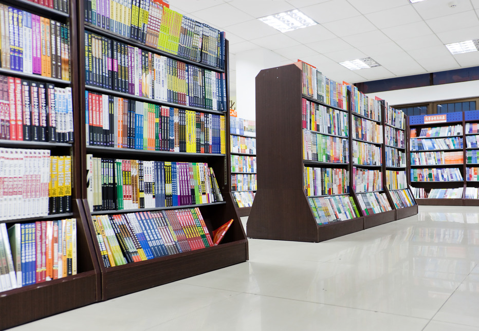 Shelves full of books in a library.